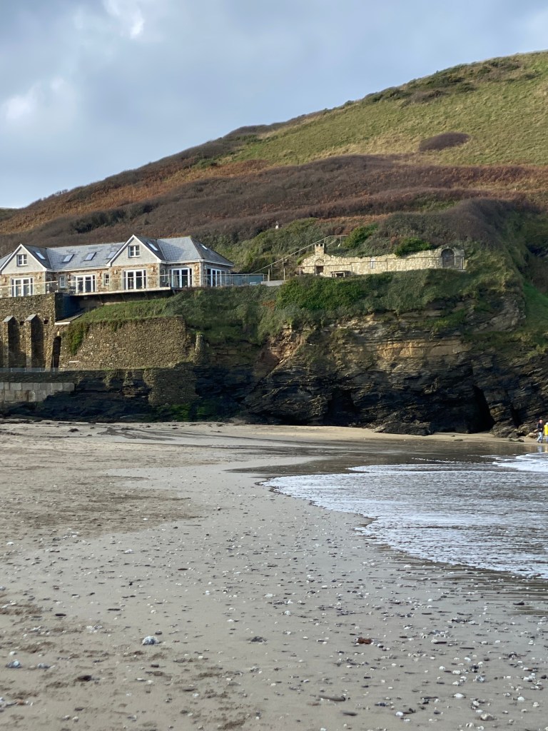 
South West Coast Path

The starting point at Minehead
Length	1,014 km (630 mi)
Location	England: Somerset, Devon, Cornwall & Dorset
Designation	UK National Trail
Trailheads	Minehead: 51.211°N 3.474°W
Poole: 50.680°N 1.950°W
Use	Hiking
Elevation change	total climbed is 114,931 feet (35,031 m)
Highest point	Great Hangman near Combe Martin, 318 m (1,043 ft)
Lowest point	sea level
Season	all year
Sights	Coastal scenery, much of it Heritage Coast
World Heritage Sites: Jurassic Coast and Cornwall and West Devon Mining Landscape
Hazards	Cliff paths, river crossings (ferries with limited availability), closure of Lulworth Ranges
National Trails
Acorn_Britain_National_Trails_Symbol-black
Acorn symbol used to guide the route of National Trails
England
Wales
Cross-border
vte
The South West Coast Path is England's longest waymarked long-distance footpath and a National Trail. It stretches for 630 miles (1,014 km), running from Minehead in Somerset, along the coasts of Devon and Cornwall, to Poole Harbour in Dorset. Because it rises and falls with every river mouth, it is also one of the more challenging trails. The total height climbed has been calculated to be 114,931 ft (35,031 m), almost four times the height of Mount Everest.[1] It has been voted 'Britain's Best Walking route'[2] twice in a row by readers of The Ramblers' Walk magazine, and regularly features in lists of the world's best walks.[3]

The final section of the path was designated as a National Trail in 1978.[4] Many of the landscapes which the South West Coast Path crosses have special status, either as a national park or one of the heritage coasts. The path passes through two World Heritage Sites: the Dorset and East Devon Coast, known as the Jurassic Coast, was designated in 2001,[5] and the Cornwall and West Devon Mining Landscape in 2007.[6]

In the 1990s it was thought that the path brought £150 million into the area each year,[7] but new research in 2003 indicated that it generated around £300 million a year in total, which could support more than 7,500 jobs.[4] This research also recorded that 27.6% of visitors to the region came because of the Path, and they spent £136 million in a year. Local people took 23 million walks on the Path and spent a further £116 million, and other visitors contributed the remainder. A further study in 2005 estimated this figure to have risen to around £300 million.[8] Following investment through the Rural Development Programme for England, more detailed research was undertaken in 2012, and this found the annual spend by walkers to have risen to £439 million which sustains 9771 full-time equivalent jobs.[9]