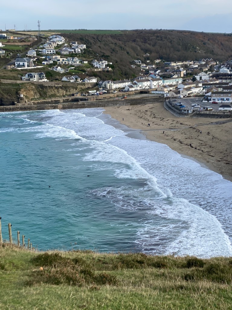 
South West Coast Path

The starting point at Minehead
Length	1,014 km (630 mi)
Location	England: Somerset, Devon, Cornwall & Dorset
Designation	UK National Trail
Trailheads	Minehead: 51.211°N 3.474°W
Poole: 50.680°N 1.950°W
Use	Hiking
Elevation change	total climbed is 114,931 feet (35,031 m)
Highest point	Great Hangman near Combe Martin, 318 m (1,043 ft)
Lowest point	sea level
Season	all year
Sights	Coastal scenery, much of it Heritage Coast
World Heritage Sites: Jurassic Coast and Cornwall and West Devon Mining Landscape
Hazards	Cliff paths, river crossings (ferries with limited availability), closure of Lulworth Ranges
National Trails
Acorn_Britain_National_Trails_Symbol-black
Acorn symbol used to guide the route of National Trails
England
Wales
Cross-border
vte
The South West Coast Path is England's longest waymarked long-distance footpath and a National Trail. It stretches for 630 miles (1,014 km), running from Minehead in Somerset, along the coasts of Devon and Cornwall, to Poole Harbour in Dorset. Because it rises and falls with every river mouth, it is also one of the more challenging trails. The total height climbed has been calculated to be 114,931 ft (35,031 m), almost four times the height of Mount Everest.[1] It has been voted 'Britain's Best Walking route'[2] twice in a row by readers of The Ramblers' Walk magazine, and regularly features in lists of the world's best walks.[3]

The final section of the path was designated as a National Trail in 1978.[4] Many of the landscapes which the South West Coast Path crosses have special status, either as a national park or one of the heritage coasts. The path passes through two World Heritage Sites: the Dorset and East Devon Coast, known as the Jurassic Coast, was designated in 2001,[5] and the Cornwall and West Devon Mining Landscape in 2007.[6]

In the 1990s it was thought that the path brought £150 million into the area each year,[7] but new research in 2003 indicated that it generated around £300 million a year in total, which could support more than 7,500 jobs.[4] This research also recorded that 27.6% of visitors to the region came because of the Path, and they spent £136 million in a year. Local people took 23 million walks on the Path and spent a further £116 million, and other visitors contributed the remainder. A further study in 2005 estimated this figure to have risen to around £300 million.[8] Following investment through the Rural Development Programme for England, more detailed research was undertaken in 2012, and this found the annual spend by walkers to have risen to £439 million which sustains 9771 full-time equivalent jobs.[9]